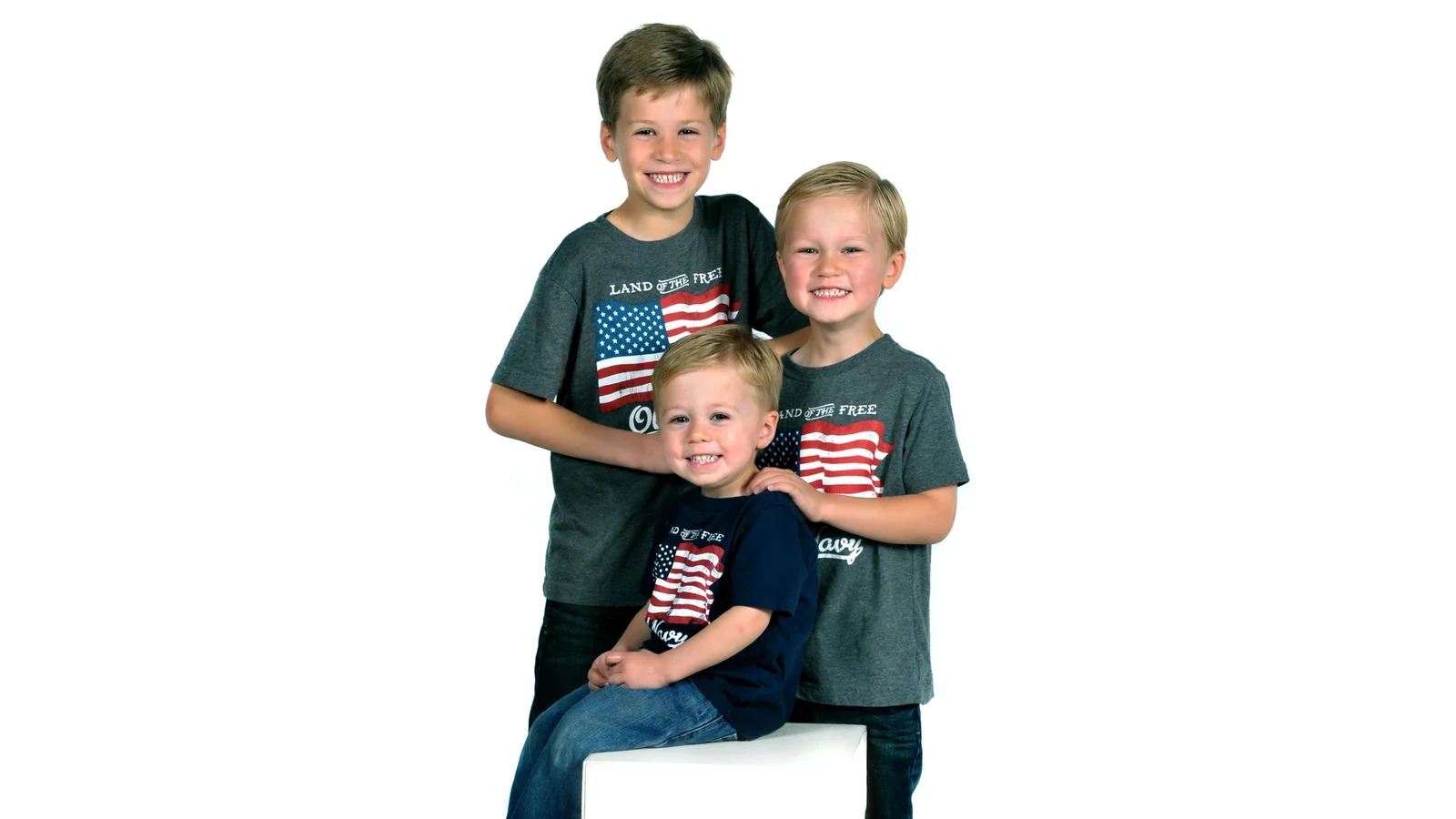 Three smiling young brothers